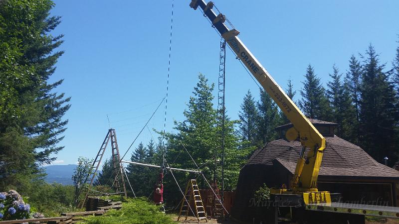 20150728_141941.jpg - Sandy hooking of a crane to lift the antenna to the top of the tower.